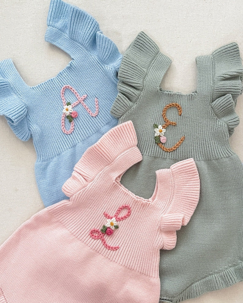initial monogrammed hand embroidered knit sweater romper for babies toddlers with ruffle trim and optional flower embroidery