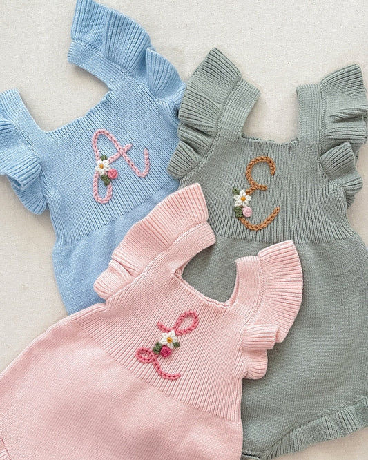 initial monogrammed hand embroidered knit sweater romper for babies toddlers with ruffle trim and optional flower embroidery