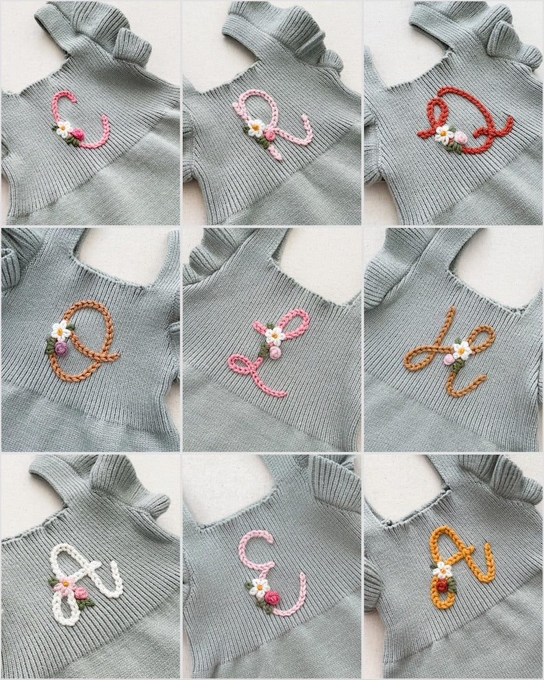 initial monogrammed hand embroidered knit sweater romper for babies toddlers with ruffle trim and optional flower embroidery